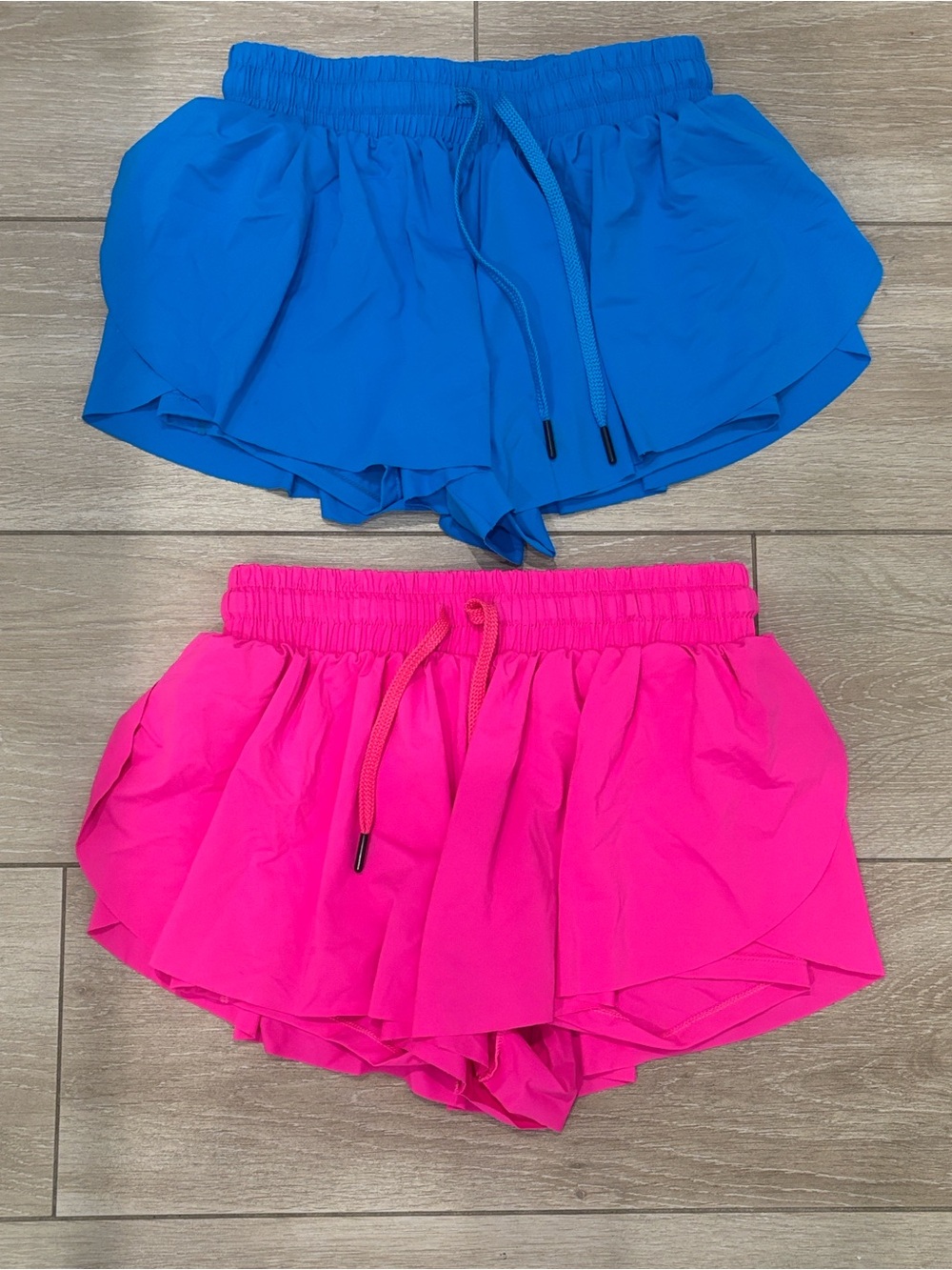 2 pairs-Girls size “12 years” butterfly flowy shorts w/ built in spandex/liner.